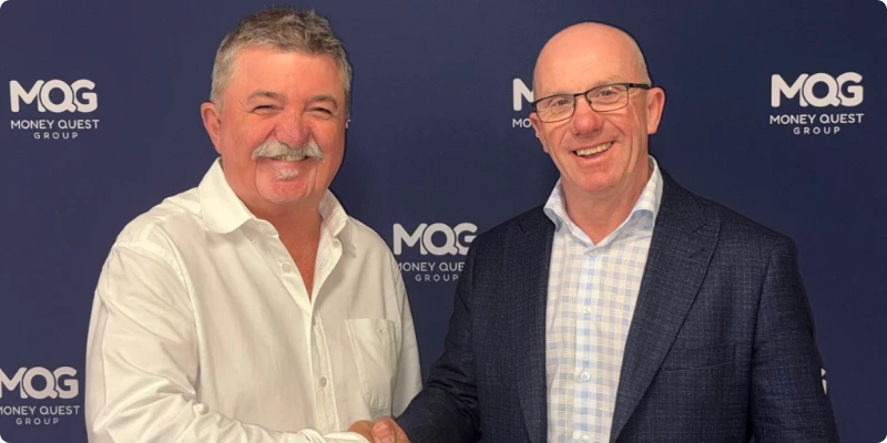 Newly appointed MQG Managing Director Sean Reid shaking hands with exiting Managing Director Michael Russell.