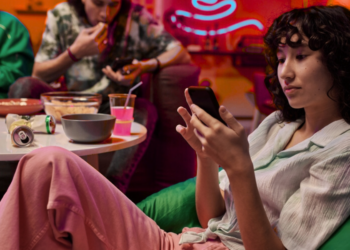 A young woman looking at her phone.